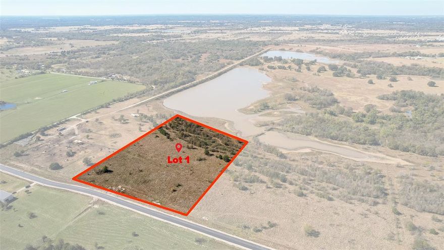 This stunning 5-acre property offers beautiful lake views, privacy, and rural charm within an exclusive gated subdivision. You can enjoy the tranquility of the country, but have have easy access to major highways, shopping, and dining.  Community has paved roads, and underground utilities. Don't miss this opportunity! Not many lots left in the Wolf Creek Ranch Development. Tract has beautiful mature trees at the back of the lot and lake views. Utilities at the road - Oncor power, Macbee water.