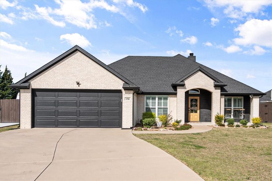 Picture-perfect and move-in ready in Palmer ISD! This beautifully maintained 4-bedroom, 2-bath home offers the perfect blend of style, comfort, and functionality. Step inside to a welcoming living room featuring a cozy wood-burning fireplace—ideal for relaxing evenings or gathering with family and friends. The kitchen is both modern and stunning, complete with granite countertops and a layout designed for everyday living and entertaining. The spacious primary suite provides a peaceful retreat with an ensuite bathroom featuring dual sinks, a garden tub, and a separate shower. Three additional bedrooms and a well-appointed hall bathroom offer plenty of space for family, guests, or a home office. Granite countertops carry throughout the home, adding a cohesive and upscale touch. Enjoy the outdoors in the fenced backyard, perfect for pets, play, or entertaining. The covered porch and patio is perfect for entertaining and enjoy the sunshine with friends and family. With over half an acre lot size there is plenty of room to roam and play! A parking pad behind the gate in the backyard offers convenient space and security for a camper, trailer, or additional vehicles. Plus, the roof was replaced approximately one year ago, providing added peace of mind. This home truly checks all the boxes—don’t miss your opportunity to make it yours!