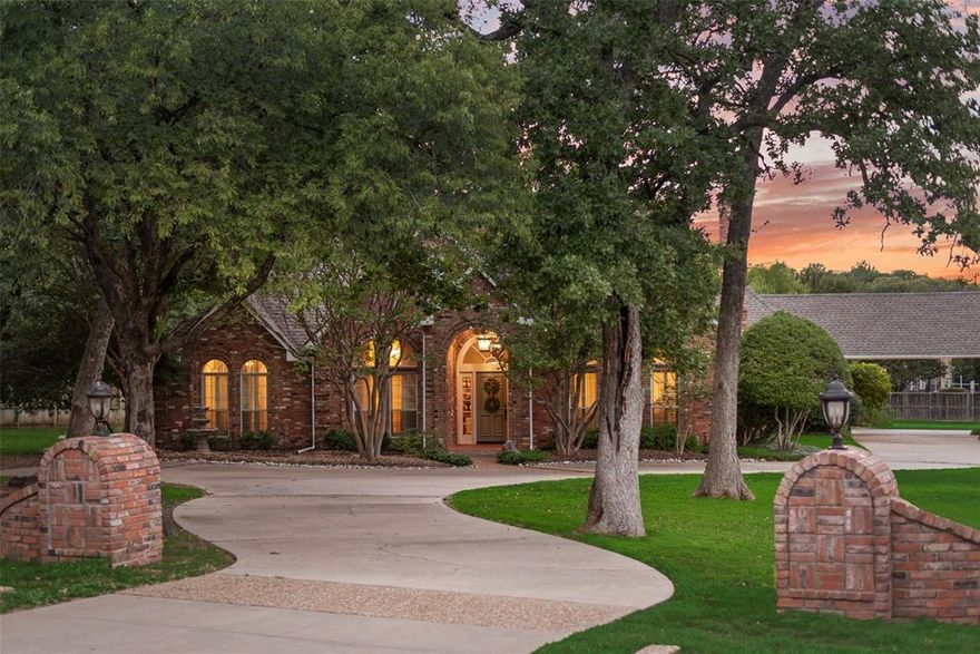 Charming Custom Home with bonus space over garage. Discover this lovely home with lots of character in the highly sought-after Canyon Oaks community. This single-story home with a finished out bonus space with full bath on a second level above the garage, sits on over an acre, offering the perfect blend of privacy, sophistication, and versatility for today’s professional and virtual lifestyle. Inside, two inviting living areas, each with its own fireplace and decadent hardwood floors, open to views of the pool and lush landscaped grounds. Plantation shutters, designer lighting, and beveled-glass windows create a polished, high-end feel throughout. The updated kitchen is sure to impress with stainless steel appliances, double ovens, under-cabinet lighting, and stunning polished Rhino Bianco marble countertops. The primary suite features patio access and serene views of the backyard oasis surrounded by Peggy Martin climbing roses. The spa-style bath includes a soaking tub and walk-in shower for your personal escape, as well as two closets. Four bedrooms in the main home offer endless flexibility for a home office, gym, or flex space. The private flex space above the garage includes a full bath and closet space, making it ideal for guests, a home business, or multigenerational living. A three-car garage plus extended parking easily accommodates a boat or recreational vehicles. Awesome Lantana primary and elementary schools and Guyer High School. Minutes away from shopping, dining, and medical services. This property delivers luxury living with the freedom to work, entertain, and unwind—all in one stunning location.