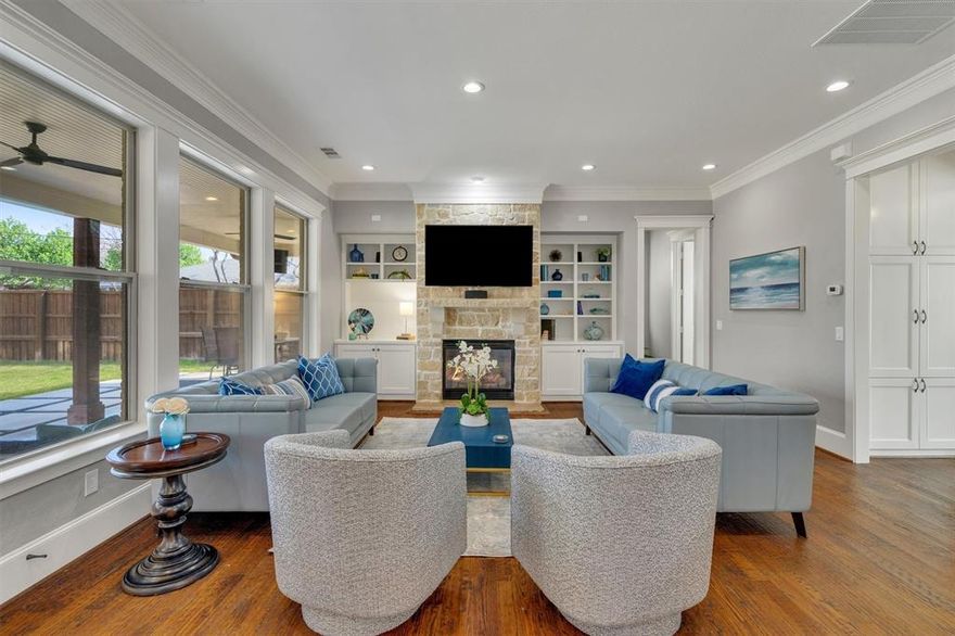 Timeless Preston Hollow Elegance with Transitional Interior Design

Nestled on one of the most desirable and quietly patrolled streets in Preston Hollow, 6811 Deloche Avenue blends classic architectural presence with fresh, transitional interiors designed for modern living.

The striking stone and brick façade, steep rooflines, and manicured lawn create a refined first impression that reflects the established character of the neighborhood. Inside, light-filled spaces, clean lines, and curated finishes offer a sophisticated yet comfortable aesthetic.

The first floor is designed for entertaining and everyday ease, featuring a formal dining room, private study, expansive living area with stone fireplace, and a chef’s kitchen anchored by a generous island and professional-grade appliances. A guest suite with en-suite bath is thoughtfully positioned on the main level for visitors or extended stays.

Upstairs, the private Owner’s Retreat anchors the second level, accompanied by two additional bedrooms and conveniently located laundry, creating a well-organized bedroom wing. A separate staircase leads to an additional retreat space—ideal as a game room, junior suite, media lounge, or private office—offering flexibility for evolving needs.

This layout is ideal for buyers seeking defined bedroom separation, privacy, and versatile living zones.

Situated in one of Preston Hollow’s most prestigious pockets,  this home represents exceptional value for location, design, and livability.