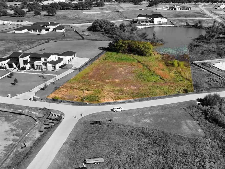 A 2-acre waterfront lot in prestigious Eagle Ridge.
This rare opportunity to build your waterfront dream home on a 2-acre lot in the prestigious Eagle Ridge community of Bartonville, TX. This exceptional homesite offers scenic water views and is surrounded by multi-million-dollar estate homes, creating a private and refined setting ideal for a luxury custom residence.
Ideally located just minutes from Highland Village shopping and the vibrant Marty B’s entertainment district, Eagle Ridge delivers the perfect balance of peaceful living and everyday convenience. For the golf enthusiast, Denton Country Club is only 10 minutes away and Lantana Golf Club is located just across the street, offering convenient access to premier golf experiences. For lake-life adventure seekers, the property is ideally situated between two of DFW’s most desirable lakes—Lake Grapevine and Lake Lewisville.
The community is zoned to the highly sought-after Argyle ISD and is also minutes from Liberty Christian School. Enjoy the advantages of luxury living outside the city while maintaining easy access to major destinations—approximately 30 minutes to Dallas and Fort Worth and just 15 minutes to DFW International Airport.
This is one of the last remaining waterfront opportunities in Eagle Ridge, offering space, scenery, and an exceptional lifestyle.