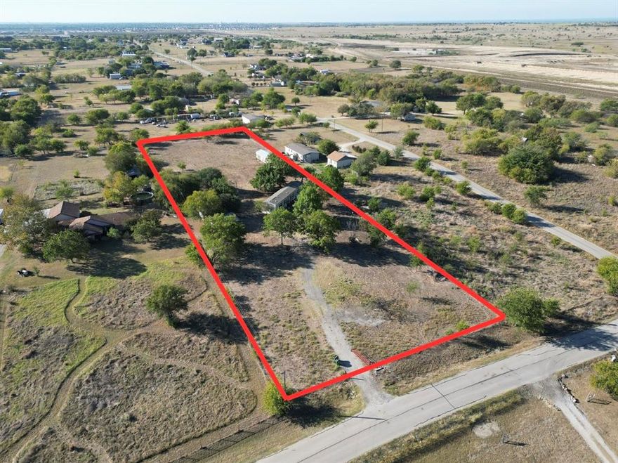 Great investment opportunity on over 2 acres offering convenient access to major highways, located approximately 5 minutes from 114 and 10 minutes from I-35W. The value is in the land, with two existing mobile homes on the property that are currently being cleaned out. The main trailer is 8 years old and has a new HVAC system as of July with 10 year warranty. A detached two-car garage and an additional storage building on site as well. Property is being sold as-is and priced to sell. Buyer and buyer’s agent to verify all information, including measurements, schools, utilities, and permitted uses.