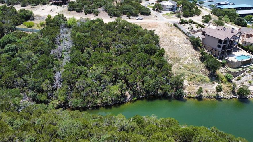 This property offers the rare opportunity to build your dream waterfront getaway or full time home within the esteemed Cliffs Resort community. Sloped lot will offer stunning views across Possum Kingdom Lake upon the completion of your build. While you are building, enjoy all this amenity rich resort has to offer such as 18 hole golf course, tennis, restaurant, spa, hotel, marina and 2 Pools. Located just around the corner from the marina, so you could be on the water within minutes of arriving.