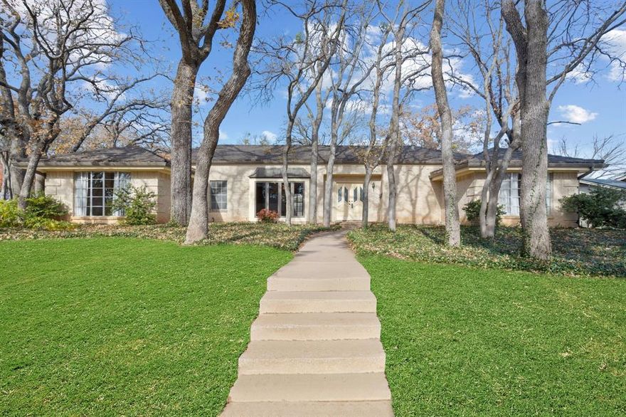 Living at 5021 Sugar Lake Road is about settling into a home that feels familiar, welcoming, and rooted in the heart of Fort Worth. Tucked beneath mature, shade-giving trees in an established neighborhood, this charming property offers the kind of setting where evenings are quieter, neighbors wave, and life feels comfortably grounded.

Inside, natural light pours through classic bay windows, creating bright, inviting spaces that make everyday moments feel special. The thoughtful layout supports the rhythm of real life—room to work from home, spaces to gather, and the flexibility of two bedrooms that can serve as peaceful primary retreats. One of these features a beautifully preserved original custom vanity and walk-in closet, adding a touch of character that tells the story of a home lovingly cared for over time.

Out back, the private yard and pool become an extension of your living space—perfect for relaxed weekends, summer get-togethers, or unwinding after a long day. Surrounded by established trees, the backyard offers a sense of privacy and calm that’s hard to find in the city.

With a newer roof and evident pride of ownership throughout, this residence offers peace of mind along with timeless appeal. Centrally located near Fort Worth’s dining, shopping, and commuter routes, you’ll enjoy the convenience of city living while coming home to a neighborhood that feels established, warm, and enduring—a wonderful place to put down roots and truly feel at home.