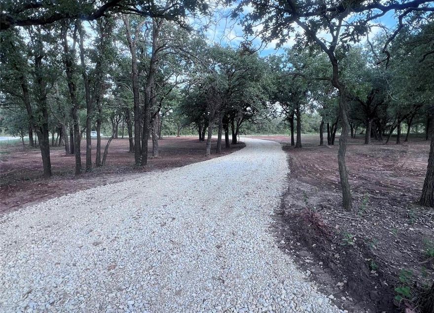 Ready to build on 3 acre lot! This stunning 3-acre parcel is ideally located right off Highway 377. This property features a convenient paved road access, making it both easily reachable and private. As you enter the property, you'll be greeted by a stunning landscape adorned with mature trees, providing a perfect blend of natural beauty and shade. The established gravel driveway leads you to a cleared pad, thoughtfully prepared for your future home!
