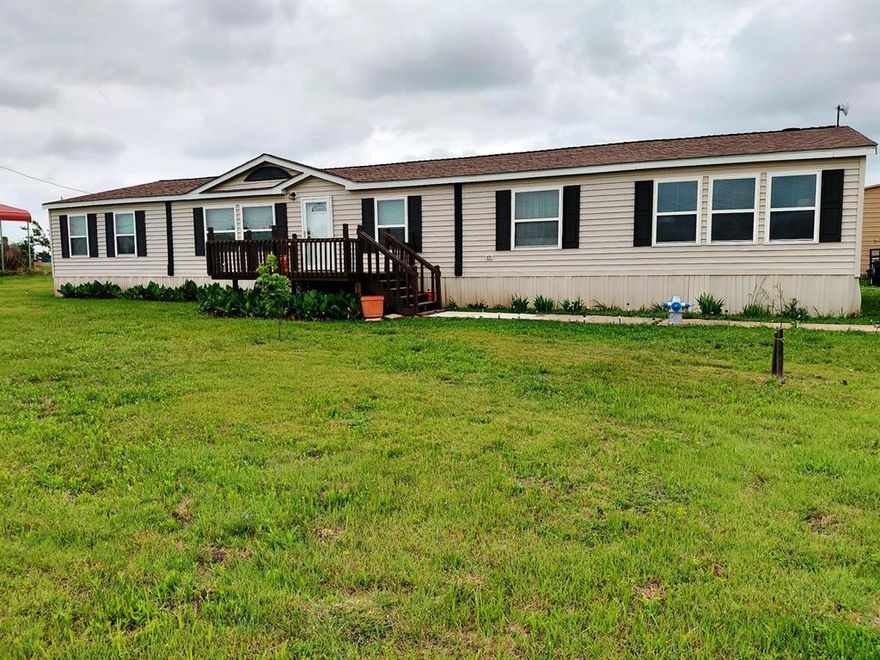 This beautiful property has been updated and includes new- skirting, electrical pole, front door and screen, flooring, showers, front, rear decks and railing. This spacious home has two living areas, one with a wood burning fireplace. Maytag appliances. Perfect for families of all types.