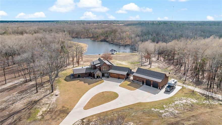 Discover a breathtaking modern home completed in 2023, set on an extraordinary 303 acres of rolling hardwood terrain and mature timber in Red River County. This expansive landscape not only creates a stunning natural backdrop but also offers exceptional whitetail deer hunting, with habitat that draws and holds trophy-quality wildlife. The property also features a 4-acre duck slough, making it a prime destination for waterfowl enthusiasts, and the home itself overlooks a serene 5-acre lake, adding both beauty and recreational opportunity right outside your door.
This property offers the perfect balance of luxury living and wide-open space, creating a private residence designed for both relaxation and unforgettable entertaining. The home features 4 spacious bedrooms and 3.5 beautifully finished bathrooms, each crafted with clean lines, modern materials, and thoughtful detail. The open-concept living areas flow seamlessly into the outdoor spaces, making the entire home feel bright, inviting, and connected to the surrounding landscape. The upstairs consists of what is currently used as a game and craft room.
Step outside to your own personal resort. A stunning inground pool anchors the outdoor living experience, complemented by both covered and uncovered lounging and dining areas—ideal for hosting gatherings, enjoying quiet mornings, or taking in the Texas sunsets. Whether you’re entertaining a crowd or savoring peaceful solitude, this outdoor setup delivers year-round enjoyment.
Car enthusiasts, hobbyists, or those needing substantial storage will appreciate the impressive 5-car garage, offering exceptional space and flexibility.
Disclaimer: All information provided herein was acquired from sources deemed reliable and is believed to be accurate. However, we do not warrant its accuracy or completeness and recommend that every item of interest be independently verified by Purchaser