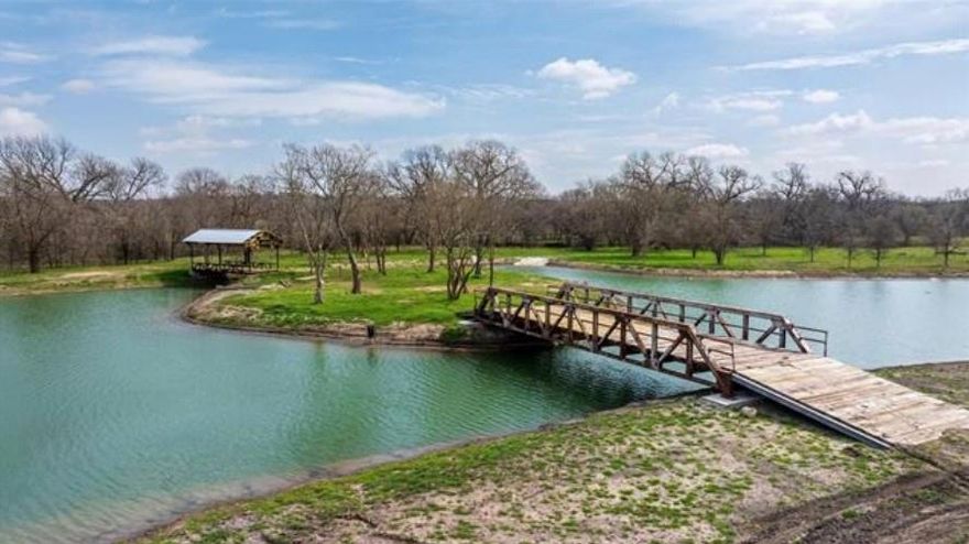 Recently permitted and lifted out of the flood zone, and strategically positioned along I-20 and the Clear Fork of the
Trinity River, this 52.3-acre tract in rapidly growing Willow Park, Texas offers unmatched visibility, access, and
development flexibility. It also lies within the county’s planned improvements for the new Bankhead Bridge and future
two-way access—enhancing connectivity and increasing long-term value. Whether you’re planning: *Five 10-acre
ranchettes with access to the Clear Fork of the Trinity River for private estates or resale at $4.17SF *25 buildable acres
for light industrial, warehouse, or flex space and 20 acres for yard use, contractor laydown, or equipment storage at
$4.85SF *A 130-home residential community in a high-demand corridor at $75,000 per lot — this site is primed for
action. City water, sewer, and electric are already available at the front of the property. Floodplain mitigation is
complete, and bridge and lake amenities are already in place, offering both functional infrastructure and aesthetic
value. The property lies outside city limits but is annexation-ready. Located just 25 minutes from Fort Worth and 15
minutes from Historic Weatherford, this property is ideal for developers, investors, and operators seeking shovel-ready
land in one of Parker County’s most strategic growth corridors.