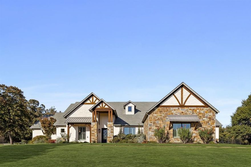 Exceptional single story custom home located on 1.8 acres in a prime location just minutes to Lake Grapevine, DFW Airport & all that Flower Mound has to offer. This thoughtfully designed layout effortlessly connects the entertainment areas into the fully equipped gourmet kitchen that features an abundance of counter & cabinet space, two sinks, two dishwashers, a pot filler, double ovens, a built in refrigerator-freezer, a top of the line gas cooktop & a generous walk in pantry. The large family room offers a corner fireplace, beamed ceiling & a wall of windows that overlooks the backyard oasis. The family room opens to the dining area & the kitchen creating a warm & inviting atmosphere. There are four spacious bedrooms each with an ensuite bathroom & large walk in closets. The primary bedroom has a large walk in closet with a storm shelter or panic room & has access to the utility room for convenience & ease. Other rooms include a study, a gameroom & a media room. Adjacent to the media room is a walk in wet bar with an abundance of cabinets, an ice maker & a built in beverage refrigerator. Have dogs? You will love the dog room with a shower & a door to an outside fenced dog run with turf. Retreat to the outdoors where you'll find a 43' outdoor living space complete with built in grill & unbelievable space to host a large gathering. You can enjoy the pool & spa year round as there is a heater for winter and a chiller for those hot summer days. 5 car oversized garage plus lots of extra parking. There are stairs to the expansive attic that offers amazing storage space. This is a rare opportunity to own a sprawling, single-level home in a premier location, offering space, style, and amenities that truly stand out.