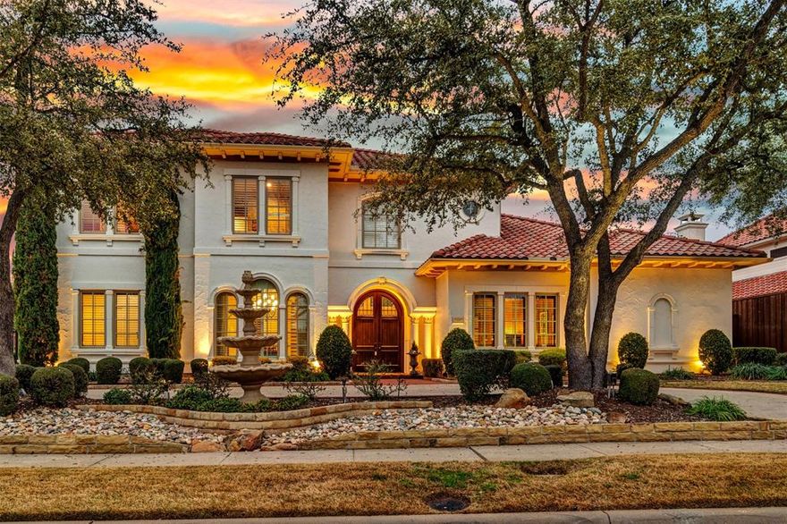 Fantastic Mediterranean style home offers supreme luxury in every room! Curved wood double doors usher you into a foyer emphasizing the formal living room with gas log fireplace and 28ft ceiling and a wall of windows facing the patio and pool. A wet bar with wine fridge leads to the family room with built-ins framing a gas log fireplace and the gourmet kitchen you'll adore! The kitchen offers not only a large center island with custom cabinets, there's a Thermador 5 burner gas cooktop, Bosch dishwasher (2019), GE Cafe double oven (2020), 5 stage reverse osmosis water filter and granite butler's pantry to the formal dining room. You'll feel like royalty in the primary suite with double-sided gas log fireplace to the bath, high ceilings and large windows offering backyard views and pool access. The bath is exquisite with large double vanity, Jacuzzi tub, and 16x14 custom walk-in closet. A second bedroom is down with a private bath. Don't miss the executive home office with paneled walls, built-in wall unit and desk, coffered wood ceiling and large closet.  Upstairs offers a game room boasting a fridge, sink and built-in cabinets, also a walk-in closet leading to a separate flex space perfect for exercise, study, or additional storage! A bedroom with full bath is off the game room, making this a perfect in-law or teen suite. A nearby media room offers ceiling mounted projector with sound system and screen. Two more bedrooms also have private baths and walk-in closets. You'll spend most of your time in the backyard oasis with large patio and grassy areas, extra large pool with spa and water features. Entertain with the outdoor kitchen: 6 burner gas grill, sink, fridge, bar, firepit plus a pergola with flagstone base! Close to DNT, 121, Legacy West, Stonebriar Mall and more.