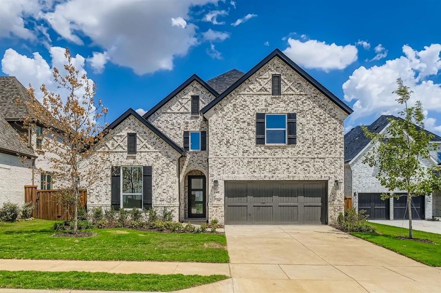 This beautiful two-story home in the prestigious master-planned community of Star Trail combines elegance, comfort and modern design. The spacious layout features five bedrooms, including both the luxurious main suite and a secondary bedroom on the first floor—ideal for guests or multi-generational living. A private study with soaring 16-foot ceilings and a dramatic two-story living room create an open, airy ambiance. The chef-inspired kitchen boasts floor-to-ceiling cabinetry, a walk-in pantry, butler’s bar, upgraded appliances, designer lighting and premium hardware. Upstairs, you'll find three additional bedrooms, two full baths, large game room and a dedicated media room—perfect for entertaining or family fun. Rich wood flooring flows throughout the main living areas, complemented by full oak stair treads and custom tile work that add a touch of luxury. The home is filled with natural light from an abundance of windows, and the extended covered patio offers ample outdoor living space. This home delivers both function and style in one of the area's most sought-after communities, offering access to top-rated schools, resort-style amenities and beautifully maintained surroundings. It’s the perfect blend of sophisticated design and everyday convenience.