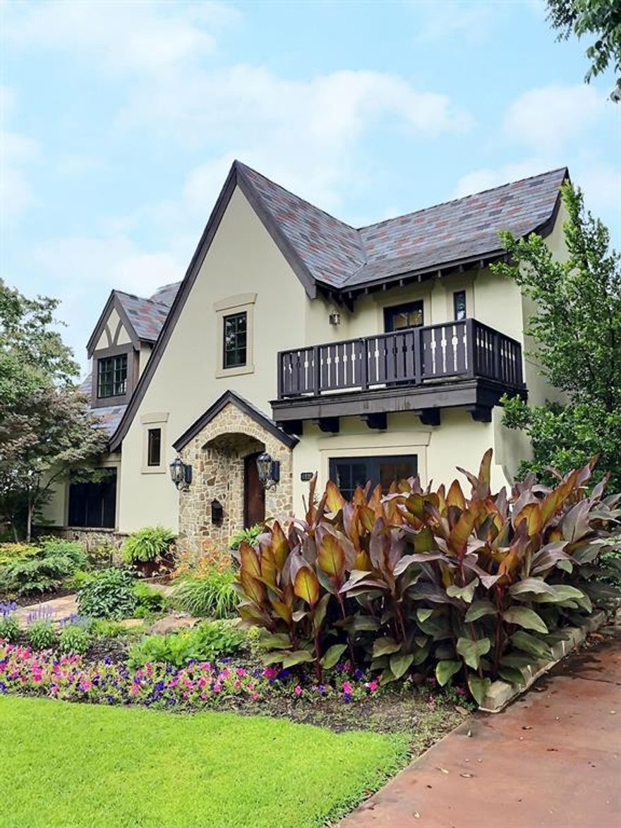 The perfect Tudor on one of Lakewood’s most prestigious streets commanding an incredible 60x214 lot! This stunning home offers the best of modern living in a classic European style. Over 4200 sqft includes 4 bedrooms, 3.1 baths, including primary & guest rooms downstairs. Cedar beam ceilings run throughout the house and complement the refinished hardwood floors. Ecostar Majestic Slate roof and professionally designed landscaping frame this idyllic home. Perfect for entertaining, featuring 2 living areas with french doors that lead to an inviting pool with water features, and an exterior living space ready-made for our hot Texas summers. The newly designed chef’s kitchen is ready for your next gathering or a weeknight meal for two.  
This is the Tudor you have been waiting for.