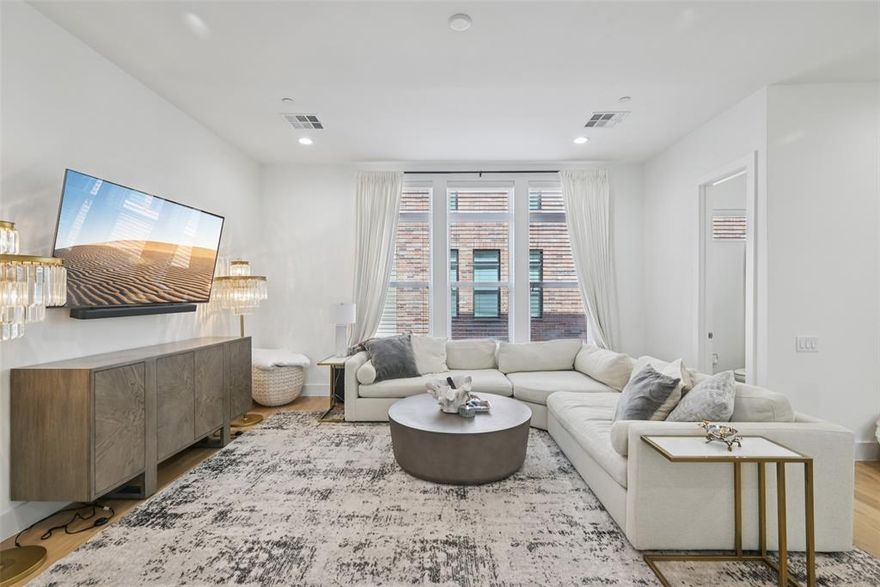 Forget cramped and cookie-cutter — this townhome brings the space, style, and sunlight you've been waiting for.

The main living level is wide open and light-drenched, with a kitchen that means business: massive island, gas cooktop, double wall ovens, farm sink, wine cooler, walk-in pantry. This is where Sunday mornings happen, where dinner parties start, where the counter never runs out of room. It flows straight into the dining and living areas — no walls, no bottlenecks, just one great room that actually functions like one.

Upstairs, the primary suite has wood floors, a real walk-in closet, and a bath with double vanity, soaking tub, and frameless marble shower. The kind of bathroom that makes you not want to leave. Second en suite bedroom on the same floor. Washer and dryer up here too — no hauling laundry between floors.

On the ground level, a full en suite bedroom opens straight to a private fenced yard through a sliding glass door. Gym, office, guest suite — or all three at different times of the week. Two-car attached garage right next to it.

And then the rooftop. Open sky, Dallas skyline, golden hour every night you want it. This is your new favorite room.

In the heart of Oak Lawn — minutes from Uptown, Downtown, UTSW, and the Medical District.

Top it all off with a rooftop deck that’s made for skyline selfies, weekend grilling, and enviable sunsets. This is the one your friends will talk about — and the one the others can’t touch.