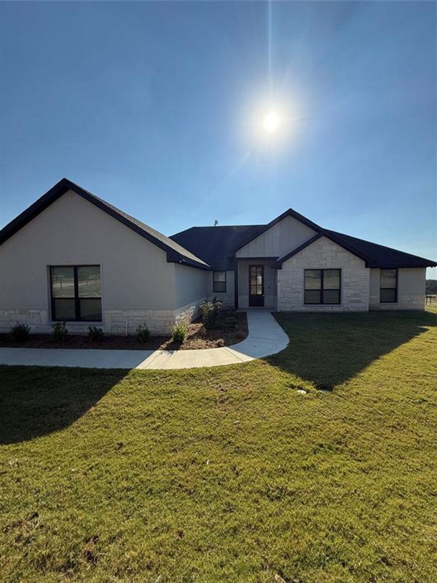 Welcome to your perfect blend of modern comfort and country charm! This beautifully updated 4-bedroom, 2-bath home sits on approximately 4 fully fenced acres, ideal for horses and outdoor living. Step inside to discover a modern interior design featuring open-concept living spaces, stylish finishes, and plenty of natural light. The spacious kitchen is a true centerpiece, complete with a large island, walk-in pantry, and ample counter space—perfect for family gatherings or entertaining guests. The primary suite offers a relaxing retreat with a separate shower and soaking tub, creating a spa-like experience.
Outside, the property is fully equipped for your equestrian needs, featuring horse stalls, a small feed room, and secure fencing around the entire acreage. Enjoy peaceful mornings with your horses and stunning Texas sunsets from your own private slice of country paradise.
Additional highlights include a 2-car garage, plenty of room for outdoor recreation, and easy access to Weatherford’s shopping, dining, and schools—all while maintaining that quiet, rural charm.