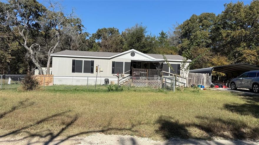 This great lot in Quinlan offers a strong opportunity for investors, builders, or anyone looking for a land value play with utilities already in place. The property includes a 3-bedroom, 2 bath double wide that needs a full renovation, giving you the flexibility to rehab it or remove it and start fresh depending on your goals.
The lot itself is the key value here, offering over a quarter acre with mature trees, a two-car covered carport, and existing co-op water, electric, and septic. Having these utilities ready to go provides a major savings compared to unimproved land.
The location offers easy access to Quinlan, local schools, Highway 276, and Lake Tawakoni, which makes this a smart option for rental investment, resale potential, or placement of a new manufactured home once improved.
If you are looking for an affordable project with solid upside potential, this one is worth a look.