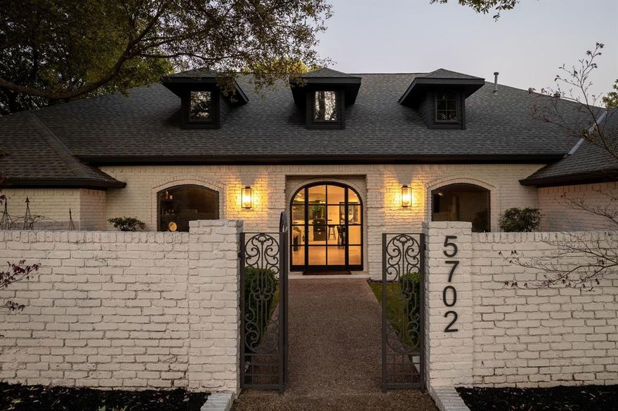 Substantially renovated in 2023, this stunning residence offers prime frontage and sweeping views of hole #3 at coveted Bent Tree Country Club. A gated front courtyard welcomes guests inside to a wide open-concept living environment featuring a modern entertainer’s bar, an inviting family room with fireplace, and a dream kitchen complete with double stone islands, high-end appliances, and a walk-in pantry room with additional counter space and an appliance station. The expansive primary suite showcases pitched ceilings, a striking stone fireplace, a spa-inspired oversized bathroom, and voluminous his-and-her walk-in closets. The home includes five bedrooms and five bathrooms, along with a dedicated home gym and a stylish office retreat. Designed for exceptional entertaining, the backyard boasts a pool, spa, and covered outdoor kitchen with pizza oven and entertainment bar overlooking the picturesque fairway. Measurements are approximate, buyer to verify room sizes and square footage.