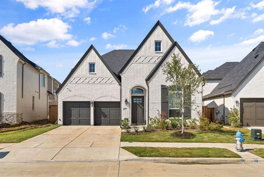 Spacious two-story residence, offering 5 bedrooms, 5 full baths and 1 half bath within approximately 3,780 sq ft of open living space. The home features an inviting main-floor primary suite with oversized walk-in closet and spa-style bath. The chef’s kitchen is appointed with a large island, high-end appliances, stone counters and walk-in pantry. Upstairs includes a game room, media theater room and guest suites. Exterior highlights include a covered patio, fenced yard and lake-view lot in the desirable The Tribute community. Interior upgrades include custom built out attic, smart-home wiring, built-in sound, luxury flooring and decorative lighting. Home with three-car garage and builder warranty in place. Community amenities include pool, trails and park in a master-planned neighborhood within Little Elm Independent School District.