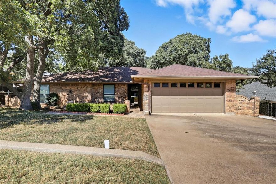 This move-in ready home is immaculate and offers spacious living with vaulted ceilings and a cozy built-in brick fireplace, perfect for those chilly winter evenings. The updated kitchen is a chef's delight, featuring an abundance of cabinetry, exquisite granite countertops, sleek stainless steel appliances, and a charming eat-in area for entertaining.The primary suite boasting an ensuite bathroom complete with dual sinks, a large soaking tub, a separate shower, and not one, but two generous walk-in closets! Step outside to discover your inviting covered patio that's ideal for morning coffee or evening unwind, along with a convenient storage building designed to keep your yard equipment neatly organized. Located in a prime area, this home is just moments away from top-rated schools, vibrant shopping options, and a quick drive to the heart of Fort Worth. Don't miss out on the opportunity to make this beautiful home your own!