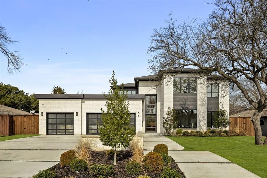 New construction in Preston Hollow that feels thoughtfully done from the moment you arrive. 5 bedrooms, 6.5 bathrooms, a main floor primary suite, pool and hot tub, 3 car garage, and easy access to downtown Dallas, all set within one of the city’s most established neighborhood. The exterior has a quiet confidence, with layered landscaping that feels just as considered in the front as it does in the backyard. Once through the door, the scale immediately opens up. Two story ceilings, a modern staircase, and herringbone wood floors create a strong first impression. At the front of the home, the dedicated office is positioned for privacy and focus. The main living area opens up with layers of texture and clean architectural lines. A grand electric fireplace anchors the room, and walls of windows bring the outside in, keeping the space light and connected to the backyard. The gourmet kitchen is a true centerpiece with marble countertops and 2 oversized center islands. Custom cabinetry, Sub-Zero Wolf appliance, statement lighting, and a butler’s pantry that feels more like a private prep kitchen elevate both everyday living and entertaining. The primary suite is located on the main floor and offers privacy and space, custom lighting and a spa inspired ensuite featuring separate vanities, a soaking tub, a walk in shower with dual shower heads, and a custom walk in closet. A main floor bedroom or game room opens directly to the backyard, pool, and hot tub, creating an easy connection between indoor and outdoor spaces. Upstairs, additional living space and guest bedrooms provide flexibility for visitors. Outside, the covered patio, pool, and hot tub create a backyard designed for both quiet evenings and entertaining, surrounded by lush landscaping. Located in Preston Hollow, known for its tree lined streets, gentle hills, long standing estates, local restaurants, and boutique shopping, this home offers space, quality, and a location that continues to stand the test of time.