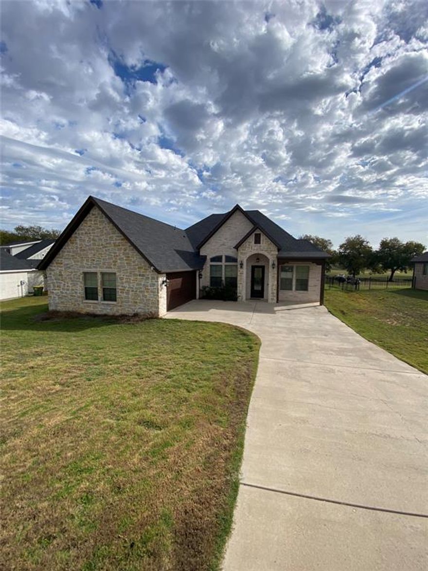 Beautiful home on Granbury's municipal golf course in Lakewood Hills.  Nice large private lot with a golf course view! Home has a spacious living room with wood look tile floors and a cozy gas fireplace. The master suite features a large bathroom with separate shower and a jetted tub. Located just off Hwy 377 on the Ft Worth sine, but in an area that is surprisingly private. Beautiful upgrades throughout the home include granite, fixtures and lighting.  This home is bright and open with plenty of room, as the study also has a closet and could be used as a 4th bedroom. There is lots of storage, a separate dining room, and a large mud bench. Great shopping and dining just up the road and easy access to Ft Worth from this convenient location. Information in this listing to be verified. Vacant and Ready for you!  Lease instructions and application are in documents