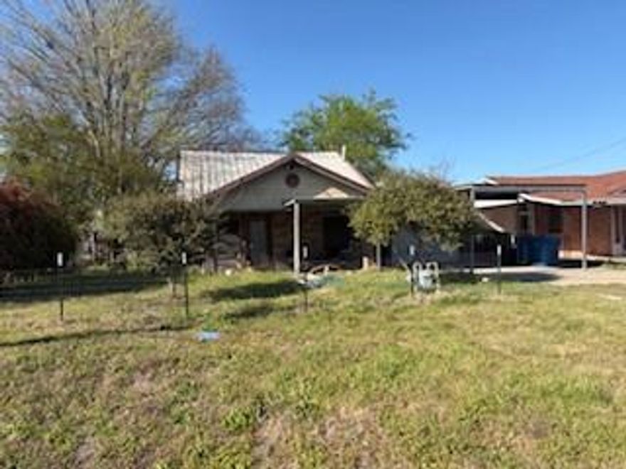 Investor-friendly opportunity being SOLD AS-IS, this 3-bedroom, 2-bath home in an established area of Mexia offers 1,160 square feet of living space on a 7,144 sq ft lot with plenty of potential to add value. The layout provides a solid foundation with tile flooring throughout the main areas for durability and easy upkeep, while the living space flows into a breakfast bar that connects naturally to the kitchen. The kitchen features built-in shelving and a functional setup that can be reimagined to suit your vision. Outside, the spacious yard gives you room to expand, create outdoor living areas, or enhance the overall appeal, and the covered carport adds everyday convenience. Whether you are looking for your next investment, rental property, or a project to make your own, this home presents a practical opportunity in a location with access to local shops, schools, and main roads for commuting. Schedule a showing to see the potential firsthand.