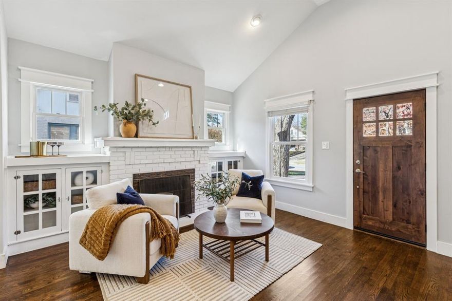 Located on a picturesque, tree-lined street in one of Dallas’ most beloved neighborhoods just a short walk to Tietze park, dining, shopping, and local favorites, this stunningly updated and expanded Craftsman sits on an oversized lot and blends timeless charm with a thoughtful, modern floor plan.
Taken to the studs and enlarged in 2016, this home boasts original architectural details and period-inspired charm paired beautifully with updated, custom finishes and designer hardware throughout.
Inside, warm hardwood floors, a soaring entry ceiling, elegant built-ins, and abundant natural light flow into open living and dining spaces designed for today’s lifestyle. The thoughtfully designed kitchen is equipped with a large quartzite island, ice maker, wine fridge, and KitchenAid appliances.  Sliding glass windows in the kitchen allow you to entertain guests as they enjoy the expansive covered back patio.
A dedicated study, sitting room and two bedrooms complete the first floor. This home offers a rare two-primary-suite layout (one on each floor) plus a separate guest house—perfect for multi-generational or flexible family living and hosting with ease.
The second floor offers a secondary living space or game room, a bedroom with ensuite bath, a large laundry room, and a luxurious primary suite with dual walk-in closets, dual sinks and vanities, heated bathroom floors, and a spa-like walk-in shower featuring multiple Grohe shower heads. A private patio off the primary suite is the perfect place to start your morning or unwind at the end of the day.
The landscaped backyard features a sparkling heated pool with in-floor cleaning system, spa, ample turfed play space, Ipe deck and a fully equipped guest house with full bath—ideal for visiting family, a home office, or studio. Smart home technology, built-in surround sound indoors and out, a gas fireplace, custom Elfa shelving, Bain air massage tub, and three gas tankless water heaters elevate functionality.