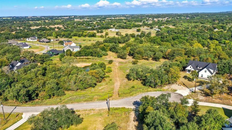 Build your dream home on 2.001 acres in Parker County! Tucked at the end of a quiet cul-de-sac, this homesite offers privacy, mature trees, and sweeping views. A house pad is already in place, making your build easier to start. With thoughtful restrictions in place—but no HOA—you’ll enjoy both peace of mind and the freedom to create the lifestyle you want. This property is the perfect blend of country charm and convenience, ready for your vision to come to life.