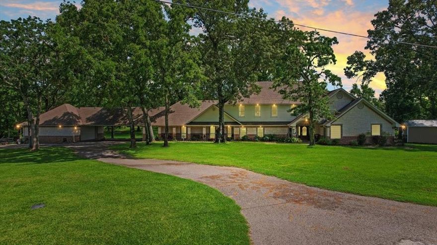 Your Lake Athens retreat awaits! This spacious home is located on a peaceful cove near open water and features beautiful updates throughout. The property offers ample space for entertaining, including a screened-in porch and an expansive back deck. The kitchen is a cook's dream! Outdoor highlights include a swimming pool and poolhouse and bar built in 2022, as well as a boathouse constructed the same year featuring two automatic lifts for a pontoon and bass boat. Inside, the home includes two dedicated office spaces, an additional upstairs living area with new flooring, and a primary suite thoughtfully connected to a laundry room and an oversized closet. The property also features two separate two-car garages connected by a covered carport, providing plenty of storage for vehicles and lake toys. The home is situated on almost 2 acres with over 370 feet for liner lakefront property.  It is perfect for a permanent lake lifestyle or a weekend getaway! Very motivated sellers. All new flooring just installed upstairs. Kitchen updated in 2022, primary bedroom, bath and downstairs bath updated in 2024.  Pool, poolhouse, boathouse and dock built in 2022. Adjacent property is also for sale and could be combined into one negotiated price.