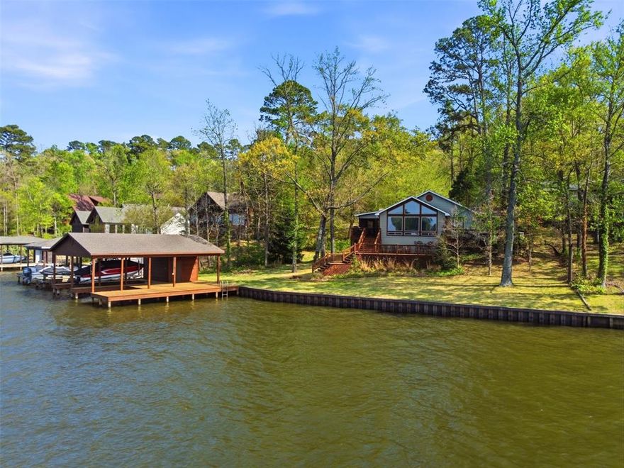 Look at that view! Hands down, one of the most spectacular views on Lake Cypress Springs, this 3-bedroom, 2-bath waterfront home offers the kind of setting buyers dream about, million dollar views for under one million dollars. Upon entry, you’re welcomed by a spacious living area with a full wall of windows showcasing breathtaking main lake views. The open concept floor plan flows seamlessly into the kitchen, which features granite countertops, stainless steel appliances, and great space for entertaining. The primary suite overlooks the lake and includes an en-suite bath, while the secondary bedrooms are generously sized and ideal for hosting family and friends. Outdoor living is just as impressive, with multiple patio spaces, beautiful landscaping, a screened in porch, and a wonderful yard to enjoy the water views. A two-stall boathouse with storage adds to the appeal. Located in an area with no HOA and county maintained roads, this property also comes furnished, making it truly move-in ready. This is a rare opportunity to own an incredible Lake Cypress Springs waterfront home at an exceptional value. Make your appointment today!