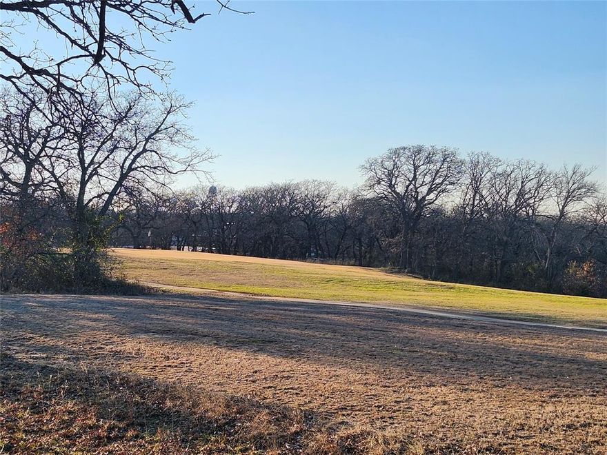 Golfers dream this beautiful .54 acre build site backs up to hole number 2 on the golf course and has great views. Mature oak trees give perfect amount of shade without blocking any views. lots are surrounded by the tranquility of nature as you will often see deer all around the property. Nocona Hills offers a 24-hour guarded gated community with access to two private lakes (one listed as top 5 Bass fishing in Texas)a community boat ramp and dock, as well as an 18-hole golf course with driving range, an airstrip, campgrounds with RV sites, and more. Utilities include co-op water and electric already at street. Fiber optic high speed internet is also available. Nearby surroundings include historic downtown Nocona, a winery, brewery and just a short drive to Saint Jo, Muenster and popular Casinos. Owner has multiple golf course lots available to choose from, please contact listing agent for details.  The Club house is under remodel along with the pool such an exciting new Update for the community.