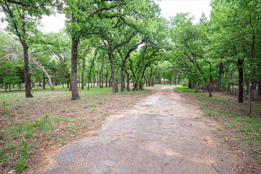 Nestled in the heart of Keller, this exceptional, heavily treed property offers a rare and versatile opportunity to create something truly special. Whether you envision building a private estate or developing multiple homesites, this property provides the flexibility to bring your vision to life.

Set among a canopy of mature trees, the land offers a peaceful, park-like setting with a sense of privacy that is increasingly hard to find. The property can be enjoyed as one expansive estate of approximately 2.803 acres or has already been thoughtfully planned for subdivision into three generous homesites—each offering ample space, beautiful natural surroundings, and the potential for stunning custom homes.

Tucked away on a quiet, proposed cul-de-sac, the layout allows for both exclusivity and functionality, making it ideal for a single luxury residence, a family compound, or a boutique development opportunity. Expansive building areas provide room for outdoor living, pools, and more—all while preserving the character and beauty of the existing trees. 

Enjoy the best of both worlds with a serene, secluded setting just minutes from top-rated schools, shopping, dining, and everything Keller has to offer. Opportunities like this—offering both privacy and flexibility in such a prime location—are truly rare.
Bring your builder, your vision, and your dreams—this is where they can all come together.