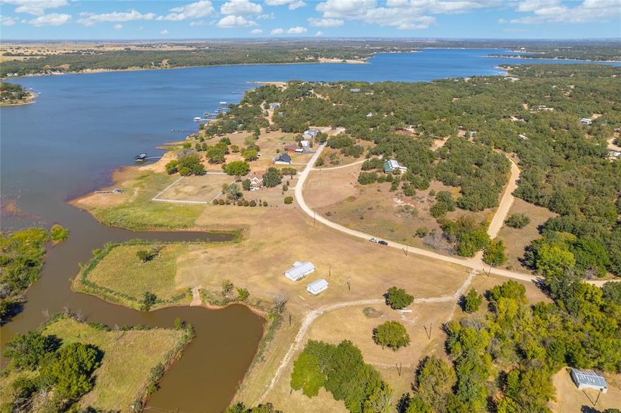 This breathtaking waterfront property presents expansive views of Lake Nocona and endless potential for various commercial uses including a marina, event center, RV park, marina fuel station, convenience store, Airbnb cabins, or personal property. Offering prime lake frontage and sunsets so beautiful you have to see them to believe them, this special parcel is arguably the most important tract of land in the entire subdivision. The almost 8.48 acres is also eligible for a 1031 exchange, making it an exceptional investment opportunity for an investor.