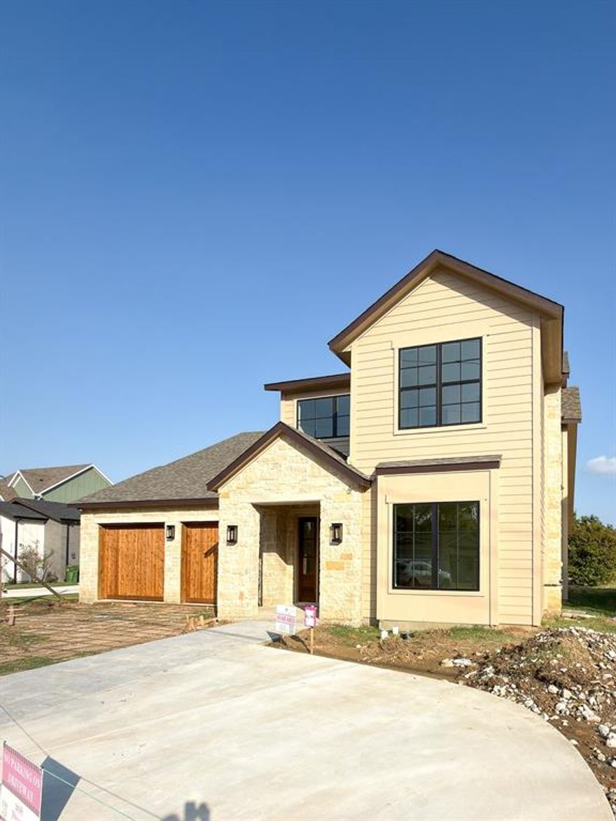 Discover this charming Craftsman style 4 bed, 4 bath home by Lily Grace Homes, perfectly placed on a large 0.69 acre lot ideal for all of your outdoor entertainment and relaxation designs.   Inside, 10 ft ceilings (11 ft in the family room), 7.5 in European white oak floors, and 8 ft shaker doors create an inviting, open feel. The kitchen boasts Bosch appliances, a quartzite island, walk-in pantry with sink, and a stylish prep kitchen designed for everyday ease and entertaining. The thoughtful floor plan includes a private office and first floor guest suite. Sliding glass doors open to an extended covered patio overlooking the spacious yard. Energy efficient touches including foam insulation, tankless water heater, 17 SEER HVAC with Ecobee thermostat, and Low E windows adding sustainability and value to the home.  Roanoke delivers that small town feel with the added perk of a lively Oak Street full of dining, shops, and local energy.