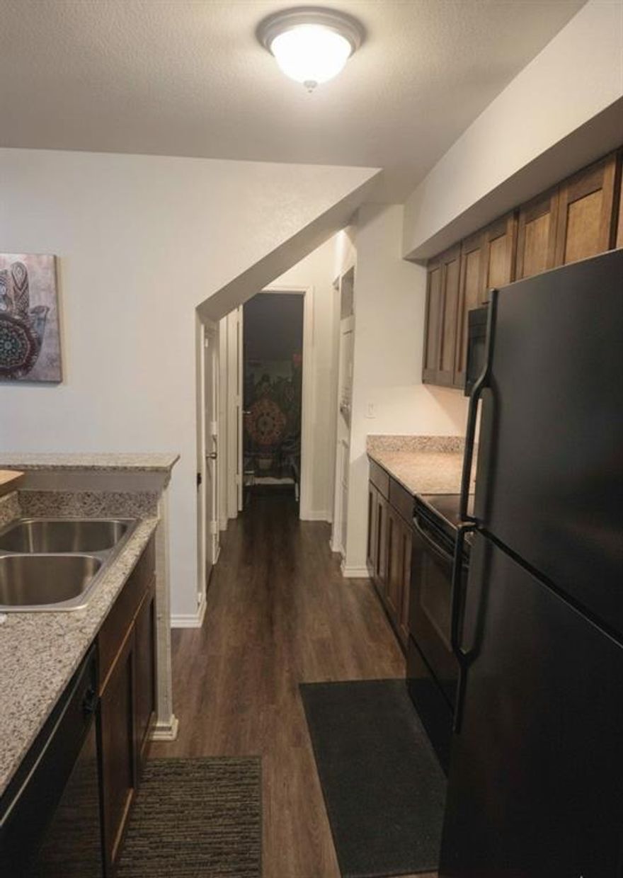 INVESTORS ONLY! Secure immediate income with this expansive 2-bedroom, 2-bathroom condo in Richland Trace. Located on the second floor, this unit features one of the complex's largest floorplans and was completely redone in 2018 with modern flooring, fresh paint, and dark kitchen cabinetry. The kitchen is upgraded with granite countertops and new appliances. Currently on a month-to-month lease at $1,300, it offers a turnkey opportunity for portfolio growth.