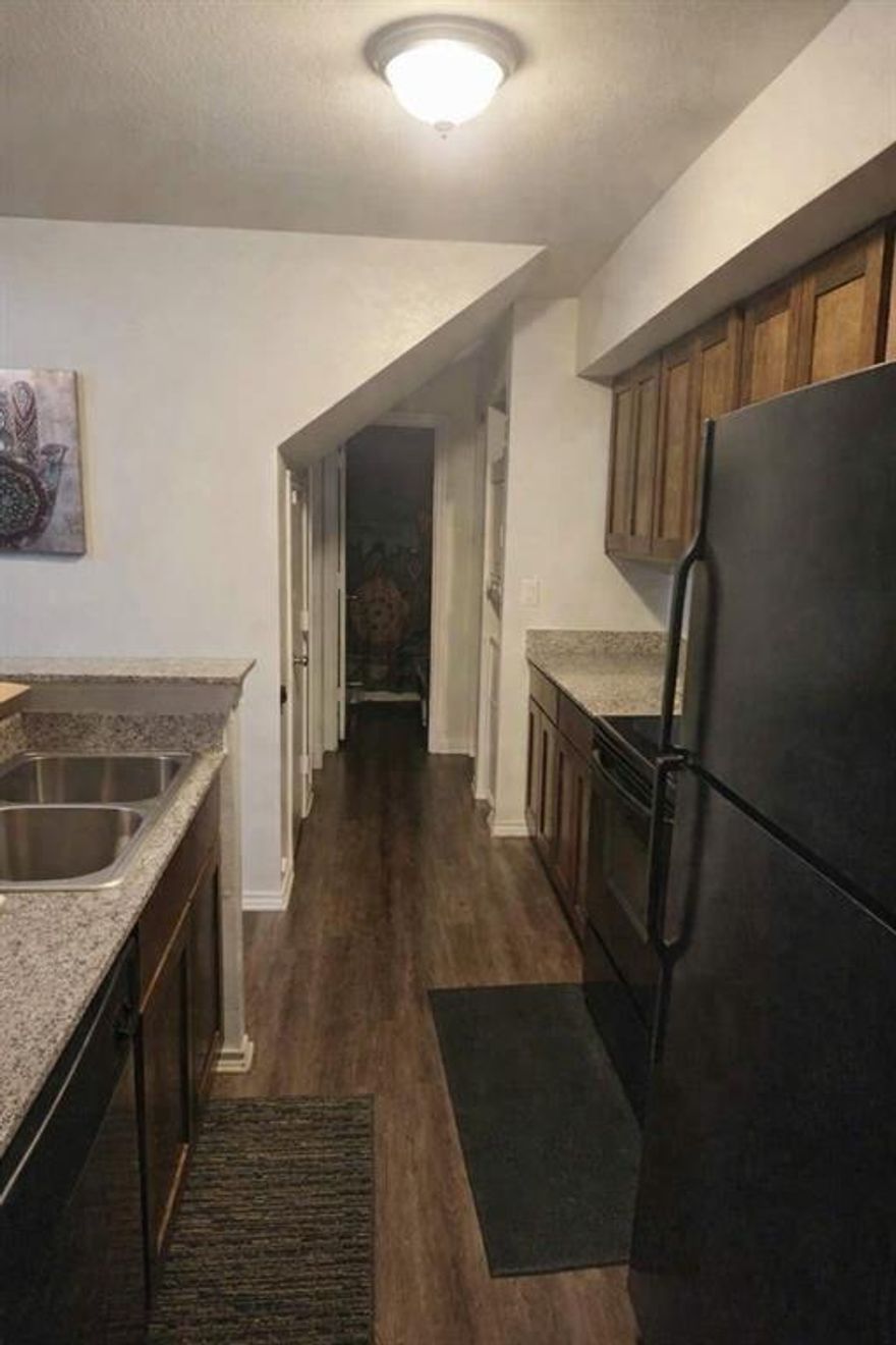 INVESTORS ONLY! Perfect 2 bedroom 3 bath investment property with immediate income located in Dalals! Located on the second floor and one of the largest floorplans in the complex. Completely redone in 2018, flooring, paint, granite countertops, new appliances, dark kitchen cabinets, water heater, fixtures and more. Current month to month lease at 1300 monthly.