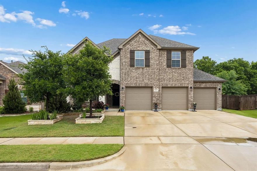 A rare opportunity in Hickory Creek, this 4-bedroom, 3.5-bath home built in 2020 sits on one of the largest lots in the neighborhood and has a 3-car garage! Newer than most surrounding homes and currently the only 2020 build available, it offers a level of comfort, efficiency, and long-term confidence that stands out immediately. Rich wood flooring carries you through the main living areas. Just off the entry, a dedicated office with French doors creates a focused space for work or creative pursuits. The kitchen’s sweeping wraparound island anchors the space, offering room to gather, prep, and serve. Quartz countertops reflect the natural light, while the upgraded appliance package offers stainless steel double ovens, a vent hood, a built-in microwave, and a 5-burner gas range. The walk-in pantry keeps everything organized and within reach, so the space stays as functional as it is beautiful. The kitchen flows seamlessly into the living area with a stone fireplace, vaulted ceilings, and large windows that bring in light throughout the day, while the layout keeps everyone connected without sacrificing comfort. The primary suite provides a private retreat, complete with a well-appointed bath featuring thoughtful upgrades, including an exterior shower control for added convenience. A spacious upstairs game room offers flexibility for recreation or relaxation, while a media room is ready for movie nights, game days, or quiet evenings in. One more detail worth noticing: An unfinished walk-in attic offers an opportunity for a bonus room, additional living or storage space, or whatever fits your vision. Step outside to a covered patio that invites slow mornings and shaded afternoons. Beyond it, the yard opens wide, offering endless possibilities for entertaining, gardening, or future additions. The wooded backdrop adds a sense of calm that’s hard to replicate, creating a setting that feels tucked away, while still having easy access to the highway for shorter commutes.