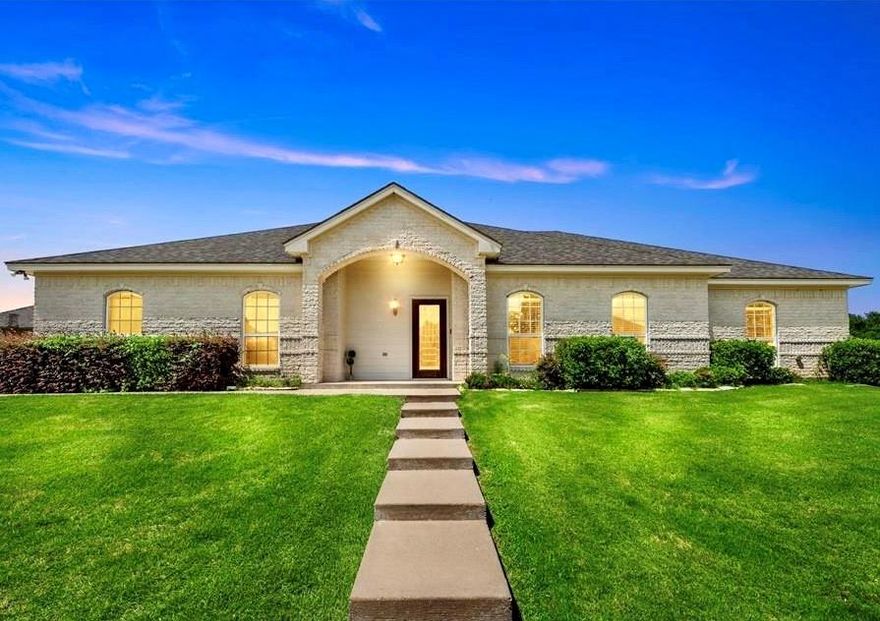 Welcome to this stunning custom home in the exclusive, gated North Shore Addition — perfect if you’re looking for privacy, a small low-maintenance backyard, and easy access to golf. Located within the private gated circle of the Lake Waco Golf Course, this home offers custom quality and beautiful finishes throughout. The heart of the home is a spacious kitchen with breakfast bar, granite counters and a generous pantry. The adjacent dining area features built-in cabinetry, and the living area is anchored by a stone fireplace — ideal for entertaining or everyday living. The expansive primary suite includes dual closets and a large tiled walk-in shower for a luxurious retreat. Additional highlights include a bonus sunroom that overlooks the patio, two generous guest bedrooms each with ensuite baths and ample closet space, two additional half baths, and many extras. The 3-door garage provides abundant storage. Located in the highly sought-after China Spring School District and minutes from Lake Waco Golf Club, this home combines convenience, comfort, and golfing lifestyle. Motivated seller…..Don’t miss the opportunity to make it yours!