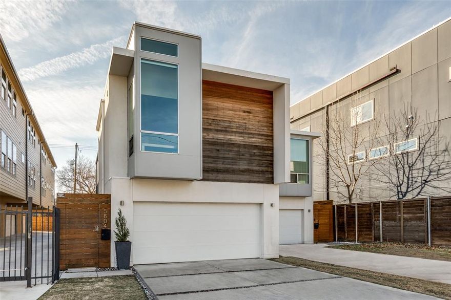 Sleek & stylish home with walls of windows, amazing natural light and no HOA!  Convenient to all that Lower Greenville, Downtown, Lakewood & White Rock Lake have to offer... yet tucked away on a quiet block within walking distance of some of Dallas' favorite restaurants!  Compared to numerous 3-story options with limited outdoor space, this 2-story property features main living areas downstairs and views out toward a covered rear patio and spacious pool-sized yard that is ideal for pets or entertaining.  In addition to the two bedroom suites, a separate oversized living area upstairs is perfect for a home office, study, studio area or gym.  Notable highlights include concrete & hardwood flooring, quartz kitchen countertops, stainless steel appliances, smooth finish walls, 10' ceilings, floating bathroom vanities with marble tops, generous closet space, separate powder bathroom, and an attached 2-car garage.  A rare opportunity in one of Dallas' most popular neighborhoods!