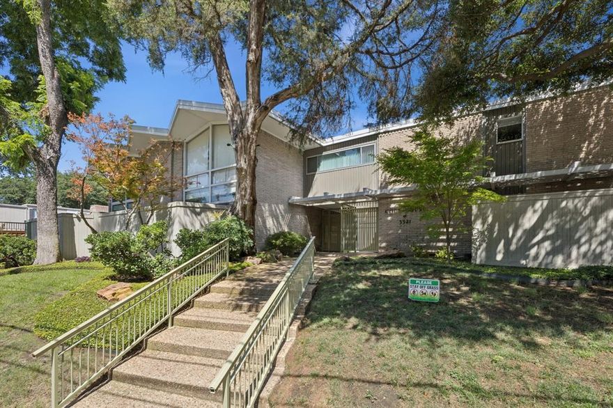 Located in the heart of Uptown, this updated mid-century modern features two bedrooms and two baths. Situated along the M-Line trolley route, it is one block from Katy Trail and 2 blocks from West Village. Gated parking leads to two reserved spots, one just steps away from the door, enter the gorgeous first floor with tile throughout. No expense was spared in the newly remodeled kitchen. A large wall of windows in the spacious living area continues the flow into the private, fenced patio. Floating wood stairs up to the second story where tile floors continue into the two large bedrooms and a full bath. This is the only unit with 2 full baths! HOA includes all utilities.