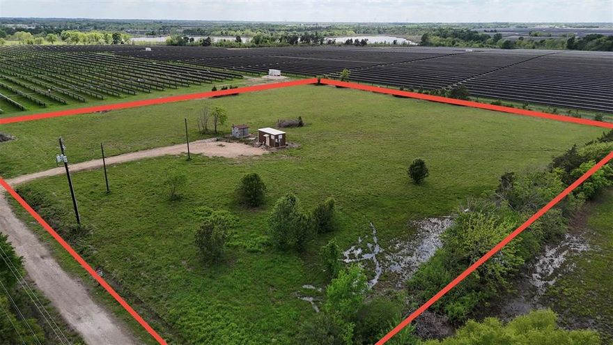 4-acre tract offering a functional and versatile layout with electricity available and partial fencing in place. Formerly utilized as a communications tower site, the property provides a stable, open setting suitable for a variety of commercial or utility-based uses. Surrounded by large-scale solar development on two sides, the location offers privacy and minimal residential interference. No water service is currently available. Ideal for equipment storage, fleet parking, laydown yard, or similar low-improvement uses. Easy access and open terrain allow for efficient use and adaptability. Buyer to verify all utilities, access, zoning, and intended use.