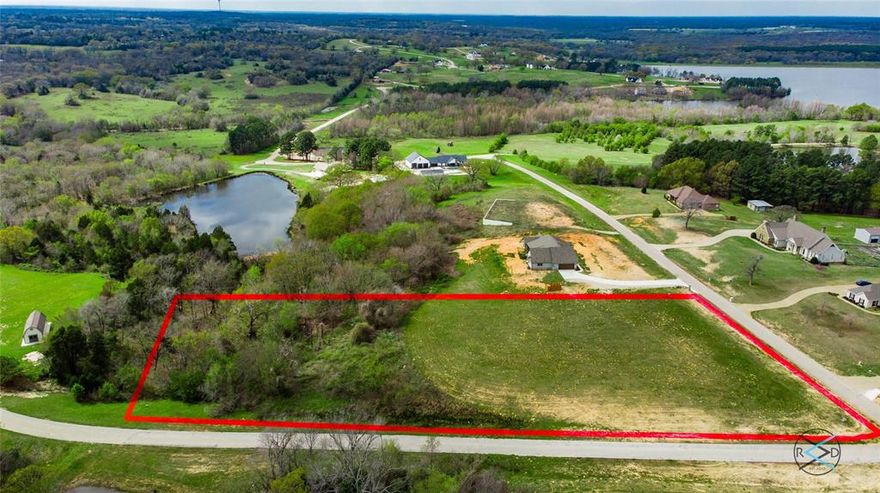 This two+ acre corner lot is ready to build on in exclusive Water's Edge Ranch!  This lot is uniquely level which can equate to less dirt work and a reduction in construction costs.  Come take advantage of this superb location to call home!
Approximately one hour and twenty minutes from downtown Dallas. Water's Edge offers true Texas-sized room to roam. Residents enjoy superb fishing in a private, 328-acre lake, a private boat launch, a resort-style pool with pavilion and the spectacular views.