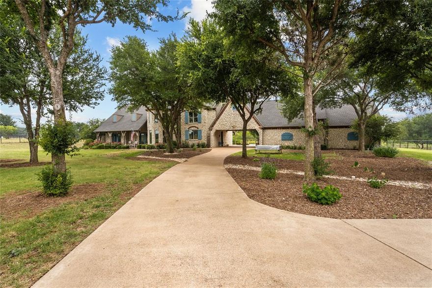 Stunning Equestrian Estate on 20.34 gated and fenced acres within the coveted Creeks of Aledo Addition! This incredible home has been completely updated with features that include quartz countertops in kitchen and baths, new gas range and stainless appliances, new Pella Windows, new flooring throughout, a fabulous master suite with wood burning fireplace and updated spa like bath! The outdoor resort style living area features a new pergola, kitchen with professional grade BBQ grill, Yoder pellet smoker, refrigerator and gorgeous diving depth pool with new pebble tech finish, stone coping and child proof safety cover. For the equestrian enthusiasts, there is a newly built sand riding arena (100 x 200) and a charming European style barn with 5 stalls, tack room and fully floored second level for hay storage or future apartment! The home is pre-wired and set-up for a generator installation. Current AG exemption. You don’t want to miss this opportunity within the acclaimed Aledo ISD!
