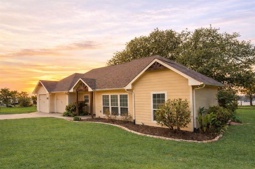 Wake up to open water views and step straight into lake life at its best. Nestled in the quiet Rustling Oaks community, this 3-bedroom, 2-bath waterfront home sits on a beautiful half-acre with 129 feet of shoreline—giving you front-row access to everything Richland Chambers Lake has to offer.

A steel retaining wall and private boathouse with lift make getting out on the water effortless, whether you're fishing at sunrise, cruising in the afternoon, or enjoying sunset rides. From kayaking and paddleboarding to hosting friends for a full day on the lake, this property is built for making memories.

Inside, large windows pull the outdoors in, filling the home with natural light and showcasing peaceful lake views. The open-concept living area features a cozy gas fireplace and custom built-ins, flowing seamlessly into a well-appointed kitchen with a spacious island, walk-in pantry, and abundant cabinetry—perfect for gathering after a day on the water.

The primary suite offers a relaxing escape with a walk-in closet and a spa-like bath complete with jetted tub and separate shower, while two additional bedrooms provide comfortable space for guests or family.

Out back, a wide lakeside deck shaded by mature trees creates the ideal setting for entertaining, grilling, or simply unwinding as the sun sets over the water. The fenced yard adds convenience, and the oversized 2-car garage offers plenty of room for vehicles, gear, and all your lake toys.

Whether you're looking for a weekend retreat or full-time waterfront living, this property delivers the ultimate blend of relaxation, recreation, and unbeatable access to the lake.