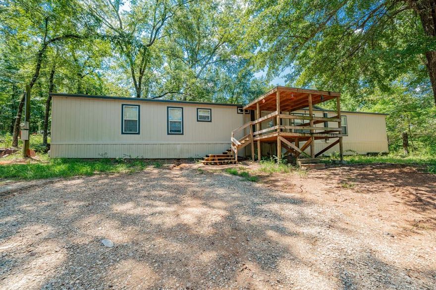 Enjoy privacy in the middle of your forest! Step into the inviting comfort of your home built in 2022. The living room welcomes with a spacious open floorplan layout, where warm natural light creates a relaxing atmosphere that seamlessly flows into the heart of the home. The kitchen offers ample countertop space, rich cabinetry, and practical functionality perfect for both casual meals and culinary adventures. The serene primary bedroom awaits, offering privacy, peaceful ambiance, and scope for personal touches. Additional bedrooms are equally charming and ready for your guests or a home office. Step out into the generous backyard, a tranquil outdoor haven with a spacious deck overlooking wooded surroundings, perfect for morning coffee, evening grilling, or simply breathing in the calm of country living. Located in a tight-knit East Texas community, residents enjoy friendly neighborhoods and small-town charm all within an easy commute, with Tyler about a 20 minute drive away, making both daily life and weekend escapes effortlessly within reach. Proudly claim Your Piece of Texas!