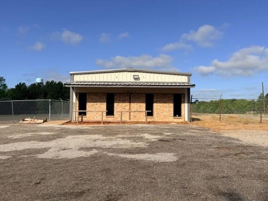 Position your business for success with this commercial opportunity in Palestine! Ideally located on the high-visibility corner of Loop 256 and N Queen Street, this 2.795-acre property offers exceptional exposure and accessibility for a wide range of commercial uses. The property features an approximately 3,000 square foot building, providing a solid foundation for your business operations, office space, or future development. Fully fenced and offering ample space, the layout is ideal for equipment storage, expansion, or customization to fit your specific needs. With strong traffic counts, excellent corner frontage, and flexible potential, this property is a rare find for investors, developers, or business owners looking to grow. Whether you're envisioning a service-based business, or a mixed-use concept, the possibilities here are endless. Don’t miss the chance to secure a strategic location with room to expand. Bring your vision and make it a reality!