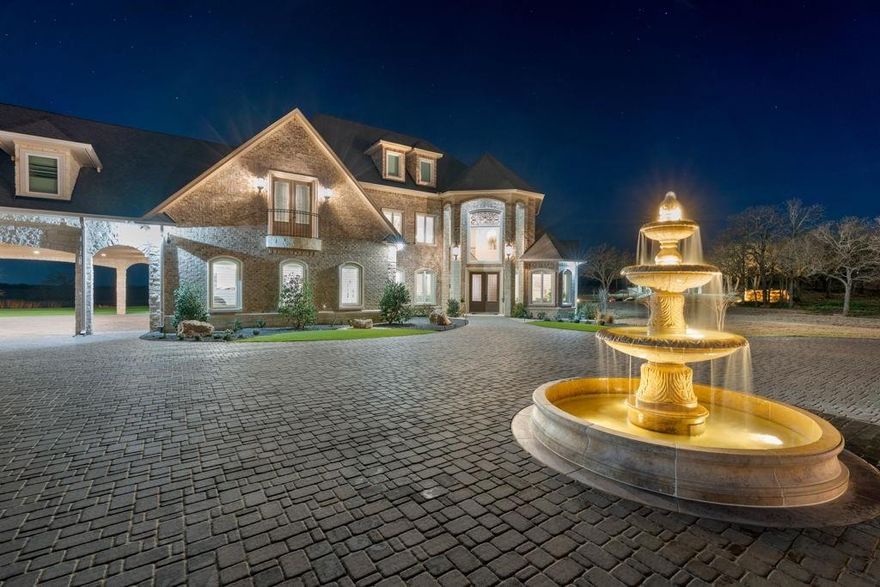 145 Acres - Exceptional Luxury Texas Estate
Set across 145 private acres, this extraordinary Texas estate blends timeless architecture, sweeping views, and refined comfort to create a truly remarkable property.Natural light fills the home’s beautifully designed living spaces, capturing the surrounding landscape at every turn. The chef’s kitchen features double islands, custom cabinetry, designer lighting, a pot filler over the range, and refined finishes- ideal for gathering and entertaining. The private primary suite offers a spa-inspired bath and custom walk-in closet, while the upper level includes three additional bedrooms, each with its own en-suite bath.The lower level is designed for entertaining, complete with a media room, full bar, office, and guest suite.Outdoor living offers a private resort-like setting with a heated pool and spa, outdoor kitchen, and an electric screened patio designed for year-round enjoyment. A gazebo pavilion overlooks a man-made river with a dramatic water wall and charming bridge, creating a striking focal point across the grounds, enhanced by professional landscape lighting and an outdoor sound system.The property also features a fully equipped guest house, insulated shop, working pens, an RV cover with water, electric, and septic hookups, and three tanks- one stocked and supplied by the private well.A rare opportunity to own a truly exceptional Texas estate.
