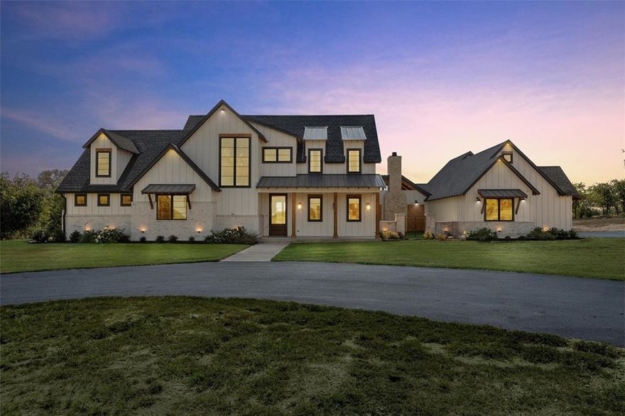 Experience the perfect blend of upscale living and wide-open space with this exceptional modern farmhouse, set on 32.9 acres in desirable Lorena ISD. This like-new, custom home offers exceptional high-end finishes and fixtures, thoughtful design, and breathtaking views in every direction.  Plank vaulted ceilings create an airy feel, while rich wood floors flow throughout the home, creating a warm and sophisticated foundation. A dedicated study off the foyer offers a private workspace, while the expansive great room is anchored by a floor-to-ceiling stone fireplace and surrounded by windows that flood the space with natural light.  The gourmet kitchen is designed for both function and entertaining, featuring a gas cooktop with commercial grade vent, a beverage refrigerator, ice machine, oversized island, and a walk-in pantry with a coffee bar and custom designed cabinetry. The primary suite, located on the main level, is a true retreat with a spa-like bath that includes a soaking tub, large tiled walk-in shower, and an expansive closet with direct access to the laundry room.  Upstairs, guests will enjoy a private suite with its own full bath. A separate wing of the home includes two additional bedrooms and baths and a large flex space—ideal for a secondary living room, home gym, or multi-generational setup.  Outdoor living is just as impressive, with a covered back porch featuring a wood-burning fireplace, built-in grill, and custom wood doors that open to a beautifully designed courtyard—perfect for year-round entertaining.  Additional features include built-in surround sound speakers, wiring in the garage for electric vehicle charging, an electric entry gate, a separate storage building, and a wet-weather creek and pond.  This is a rare opportunity to own a move-in-ready luxury estate with acreage, privacy, and convenience—all just minutes from town.