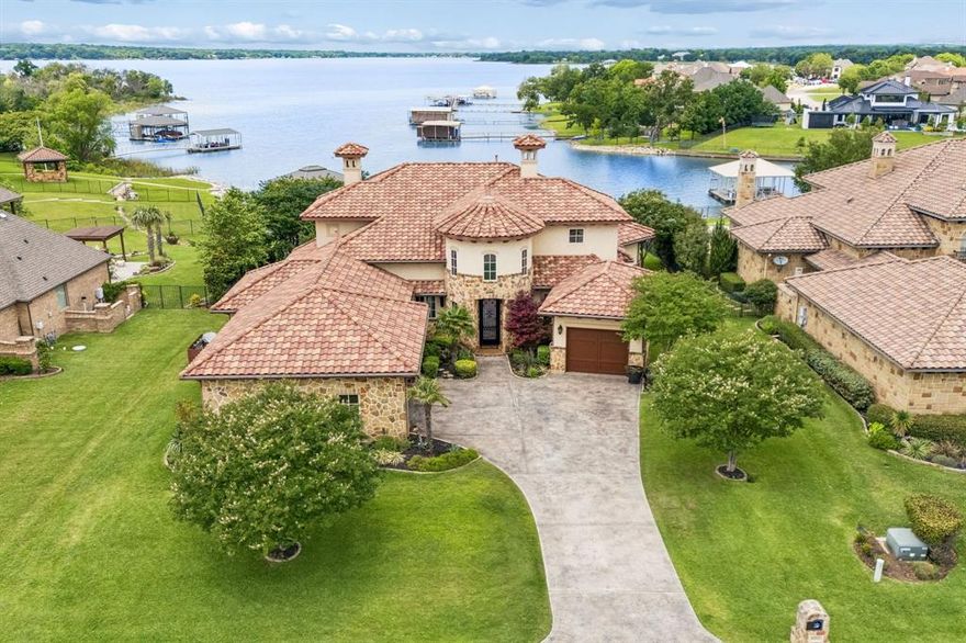 Welcome to 6212 Lakeside—an exceptional waterfront retreat on the shores of Eagle Mountain Lake with 110 feet of private waterfront and breathtaking lake views. Designed for both luxury and comfort, this home offers refined lakeside living in one of Fort Worth’s most desirable communities.

Inside, expansive windows fill the home with natural light while showcasing the beauty of the water beyond. Elegant hand-troweled walls add custom character and craftsmanship throughout the interior. The thoughtfully designed floor plan creates a seamless flow between living, dining, and entertaining spaces, all centered around the stunning waterfront setting. Step outside to a premier outdoor living area, refined with a built-in kitchen and fireplace, designed to harmonize perfectly with the home's artisan interior and panoramic views.Enjoy true open-water lakefront living with a private deep-water dock featuring a hydraulic boat lift and two jet ski slips — perfectly positioned directly on the main body of the lake, not a canal or shallow cove, providing exceptional access for boating, watersports, and year-round lake enjoyment.

Built with efficiency in mind, the home features foam insulation and radiant barrier construction, providing enhanced comfort and energy savings year-round.  

Step outside to experience true resort-style living. Whether enjoying peaceful mornings by the water, sunset gatherings, boating, fishing, or paddleboarding, this property offers direct access to the lake lifestyle buyers dream about.

The amenity-rich community includes 2 resort-style pools, a private beach, pickleball and basketball courts, an 18-hole golf course, clubhouse, fitness center, and parks, creating a lifestyle that feels like a private resort every day.

Conveniently located in Fort Worth’s sought-after 76179 area, this rare waterfront opportunity combines luxury, recreation, and tranquility in one unforgettable property.

6212 Lakeside Drive is a waterfront lifestyle.