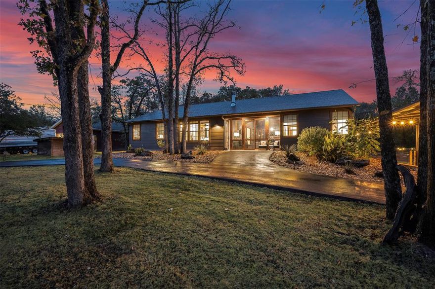 This One-Of-A-Kind luxury cabin style home features a split living (dogtrot) style with guest quarters separated from the main space by an approx 425sf four seasons screened room with fireplace opening to beautiful patios, an outdoor kitchen area, custom pool and extensively landscaped, treed yard. Lake access w boat ramp are steps away at the neighborhood park. An approx. 50x30 metal shop with an air conditioned game or craft room, loft storage, and RV carport with 220V power awaits. BIG on STYLE and SMALL on utility BILLS! Built in 2022, this home was designed to be a SELF SUFFICIENT OASIS outside of the hustle and bustle of city living. Self sufficient features include an “off grid capable” top of the line solar system with inverters and lithium battery back up bank to drastically reduce your dependence on power from electric providers, your own solar powered water well which supplies fresh, wonderful water to the house, yard, pool and gardens, a greenhouse and huge area of raised bed gardens are large enough to grow food for your family. Like the furnishings and decor? Most are available under separate agreement! Square footage doesn't include the game room area in the shop. If you need more space for a family compound see MLS number 21147267