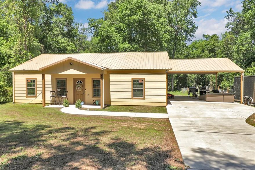 Nestled on a generous .55-acre lot, this charming 3-bedroom, 2-bath home is the perfect spot to start your family's next chapter! Imagine enjoying the privacy of your wooded backyard, or using the expansive 21x21 covered patio – ideal as a carport or for hosting unforgettable gatherings. Inside, you'll find stylish granite countertops, sleek stainless steel appliances, and easy-to-care-for luxury vinyl plank flooring throughout. Don't miss out on this fantastic starter home!